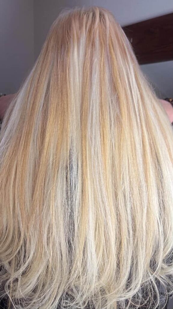Luxe Mirage Hair Extensions - AFTER PHOTO - Blonde hair keratin tip extensions installed close up